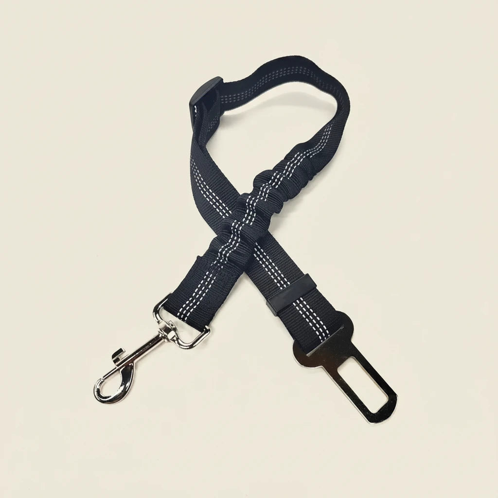 Navy blue dog harness with a clip on a white background