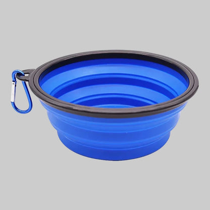 Blue collapsible dog bowl with black rim and blue carabiner 
